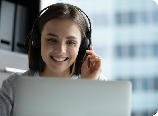 a service tech smiling at a computer