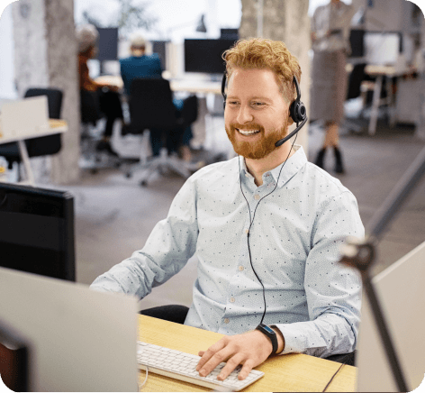 Male worker sitting at a desk in front of a computer