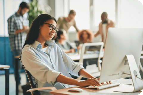 female worker sitting in front of a computer