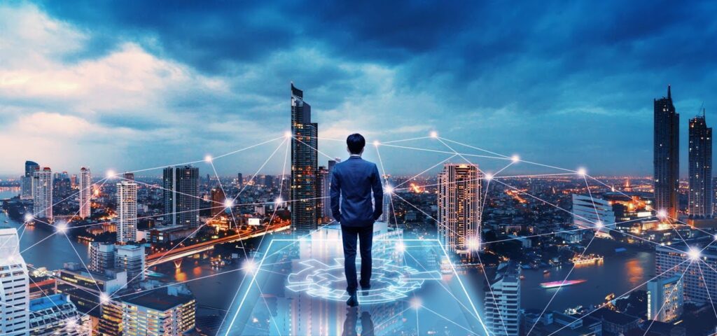 Man in a business suit overlooking a landscape with IT as an emerging technology